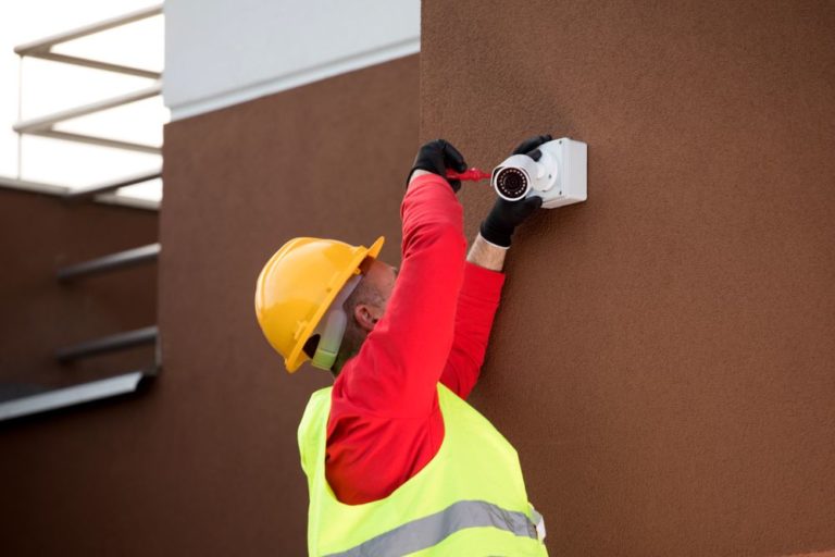 Man Installing CCTV — Security Systems & CCTV in Port Macquarie, NSW
